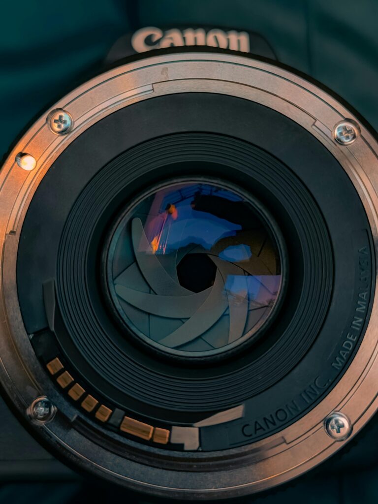 Detailed close-up photo of a camera lens showing intricate details and reflections.